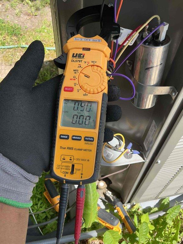 Completed comprehensive clean and check maintenance on two air conditioning systems per Comfort Plan agreement. Performed thorough inspection of outdoor condenser units, including removal of access panels to evaluate electrical components, capacitors, contactors, and wiring connections. Measured amp draw and voltage readings using digital clamp meter to verify proper system operation, with readings showing 149.1 volts and 0.037 amps on tested circuits. All electrical connections were inspected for integrity, wire terminals were secure, and capacitor condition was verified. Systems are operating within manufacturer specifications and ready for the cooling season.