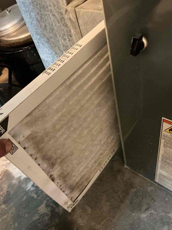 Responded to service call for air conditioning unit making unusual noises and not operating. Upon arrival, performed diagnostic inspection of the system. Found heavily soiled air filter with significant dust and debris accumulation, restricting airflow to the unit. Return air vent grille also showed substantial buildup of dust, lint, and particulate matter between slats. Replaced dirty air filter with new filter to restore proper airflow. Cleaned return air vent cover to remove debris accumulation. Cycled system to verify proper operation and confirm noise issue was resolved due to restricted airflow condition. Unit now operating normally with adequate airflow and no abnormal sounds. Documented equipment information and discussed preventative maintenance options with customer including regular filter replacement schedule.