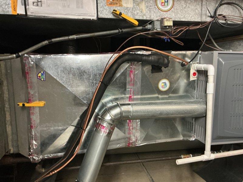 Completed warranty service on residential HVAC system by replacing defective evaporator coil due to refrigerant leak and finalizing installation of mitigation board wiring. System tested and verified operational with all electrical connections properly secured and ductwork reassembled to manufacturer specifications.