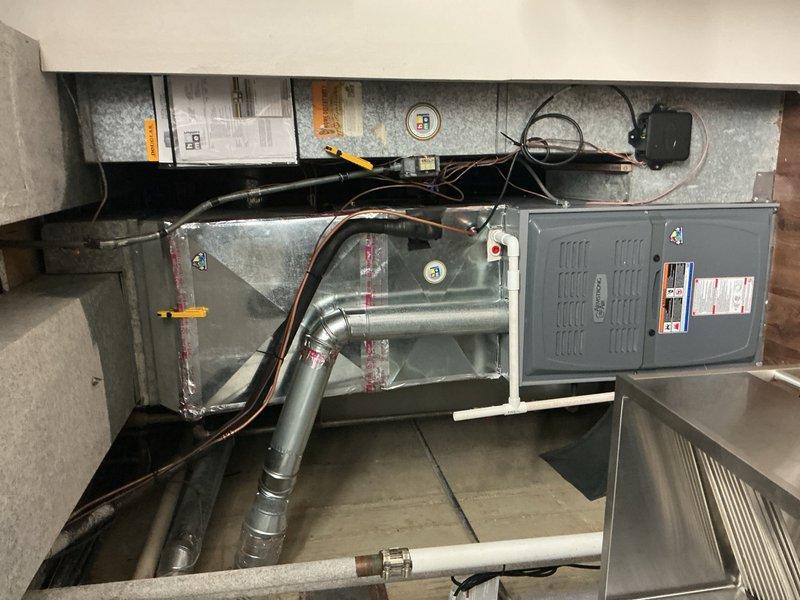 Completed warranty service on residential HVAC system by replacing defective evaporator coil due to refrigerant leak and finalizing installation of mitigation board wiring. System tested and verified operational with all electrical connections properly secured and ductwork reassembled to manufacturer specifications.