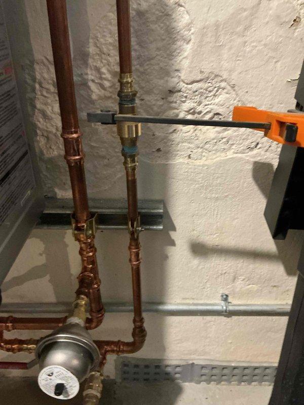 Replaced defective 3/4" check valve on hydronic system to resolve excessive pipe vibration issues. Verified and confirmed internal recirculation pump parameters were properly configured per manufacturer specifications. Inspected complete plumbing assembly including copper piping, brass fittings, shut-off valves, and compression connections to ensure proper operation and system integrity.