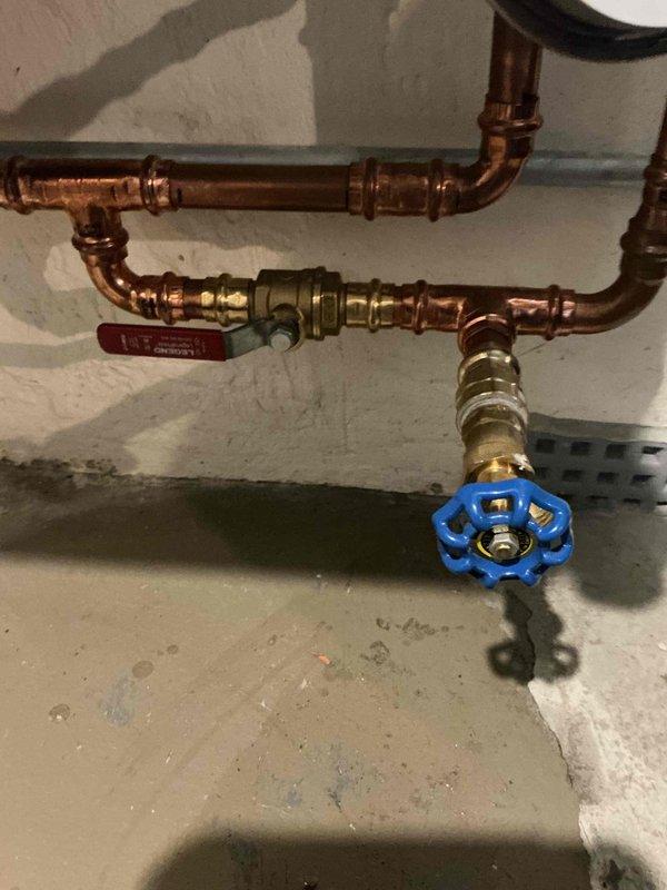 Replaced defective 3/4" check valve on hydronic system to resolve excessive pipe vibration issues. Verified and confirmed internal recirculation pump parameters were properly configured per manufacturer specifications. Inspected complete plumbing assembly including copper piping, brass fittings, shut-off valves, and compression connections to ensure proper operation and system integrity.