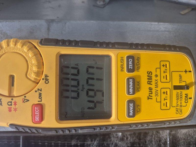 Responded to no cooling call and performed diagnostic evaluation of air conditioning system. Upon inspection, discovered excessive condensation on supply plenum in attic space, indicating potential airflow restriction or low refrigerant charge. Used digital multimeter to verify electrical readings and system operation. Documented equipment conditions with photos showing heavy moisture accumulation on ductwork, suggesting system running continuously with inadequate cooling capacity.