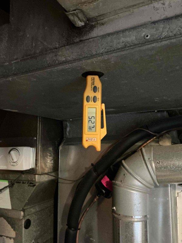 Responded to no cooling complaint on Carrier air conditioning unit with thermostat reading 87°F. Upon inspection, diagnosed failed capacitor preventing compressor operation. Replaced defective dual run capacitor with new unit meeting manufacturer specifications. Verified proper electrical connections, tested system startup, and confirmed unit cycling properly with supply air temperature reading 52°F at register. System restored to normal cooling operation.