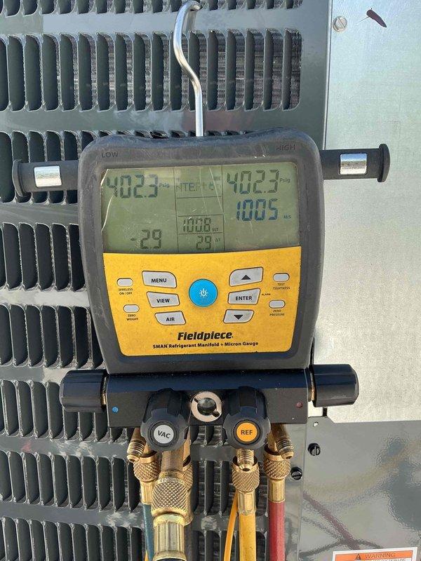 Completed commercial HVAC system replacement involving removal and installation of horizontal furnace and evaporator coil assembly in ceiling-mounted configuration. Replaced existing Bryant horizontal furnace unit positioned adjacent to previously serviced coil near entry hallway. Installed new evaporator coil to match existing 3.5-ton rooftop air conditioning condenser unit. 

Performed complete refrigerant evacuation and charging procedures on rooftop condenser, verifying system pressures and temperatures using manifold gauges. Achieved proper vacuum levels during evacuation process to ensure system integrity and moisture removal. Connected refrigerant lines between new indoor coil and existing rooftop condensing unit, pressure-tested all connections for leaks.

Configured ductwork connections to new horizontal furnace in confined ceiling space, ensuring proper airflow distribution. Verified all electrical connections, tested safety controls, and confirmed proper operation of blower 
