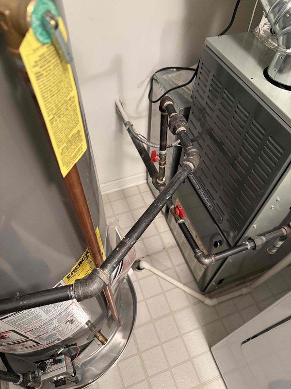 Completed spring clean and check maintenance on residential cooling system in tight utility closet space. Performed comprehensive inspection of air handler unit, evaporator coil, and refrigerant lines, with special attention to heat exchanger condition following previously identified fall concerns. Evaporator coil found clean with straight, intact fins and no debris accumulation. Verified proper refrigerant line connections, insulation integrity, and ball valve operation. All system components operating within normal parameters with no issues found during inspection.