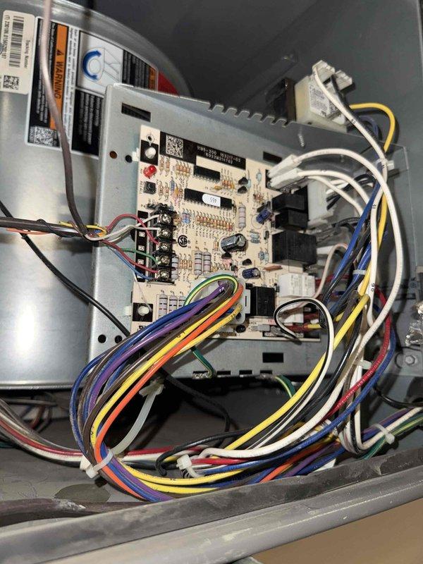 Responded to no cooling call for commercial air conditioning unit. Upon arrival, accessed control compartment and inspected electrical components, control board, and wiring harness. Found all connections secure with proper wire routing throughout the system. Control board displayed normal condition with all electronic components, relays, and integrated circuits intact. Blower motor housing and associated components verified in working order. System restored to normal operation.