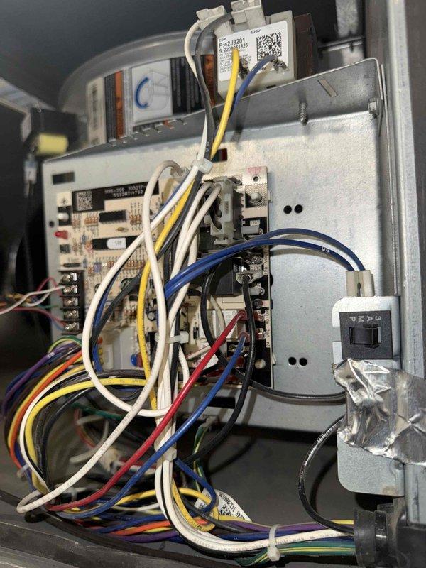 Responded to no cooling call for commercial air conditioning unit. Upon arrival, accessed control compartment and inspected electrical components, control board, and wiring harness. Found all connections secure with proper wire routing throughout the system. Control board displayed normal condition with all electronic components, relays, and integrated circuits intact. Blower motor housing and associated components verified in working order. System restored to normal operation.