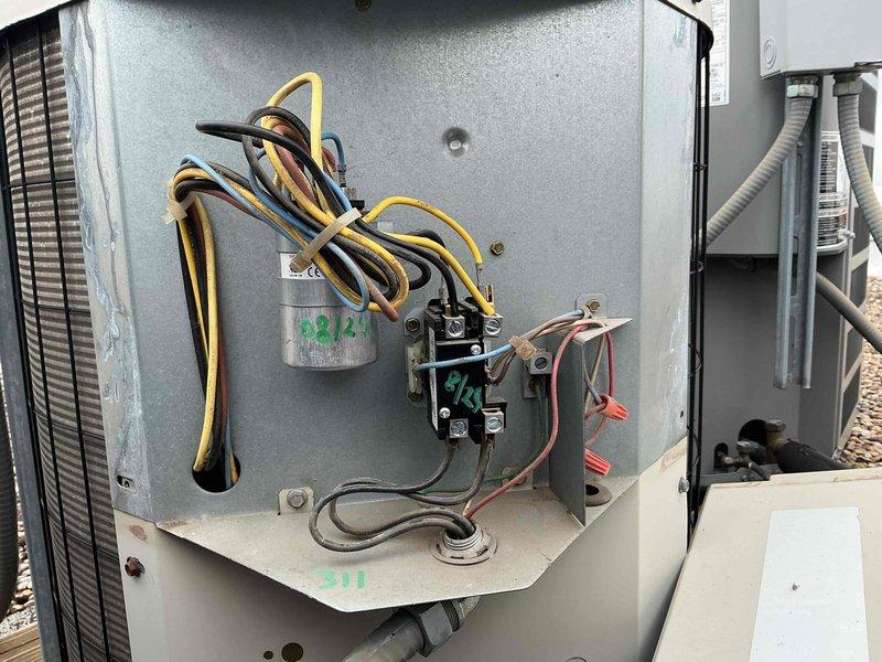 Completed Comfort Plan Clean and Check maintenance on an 18-year-old Bryant air conditioning system. Performed comprehensive inspection of air handler and condensing unit, including electrical components, contactor, capacitor, and thermostat operation. All components tested and found operating within normal parameters; system cooling properly at time of service.