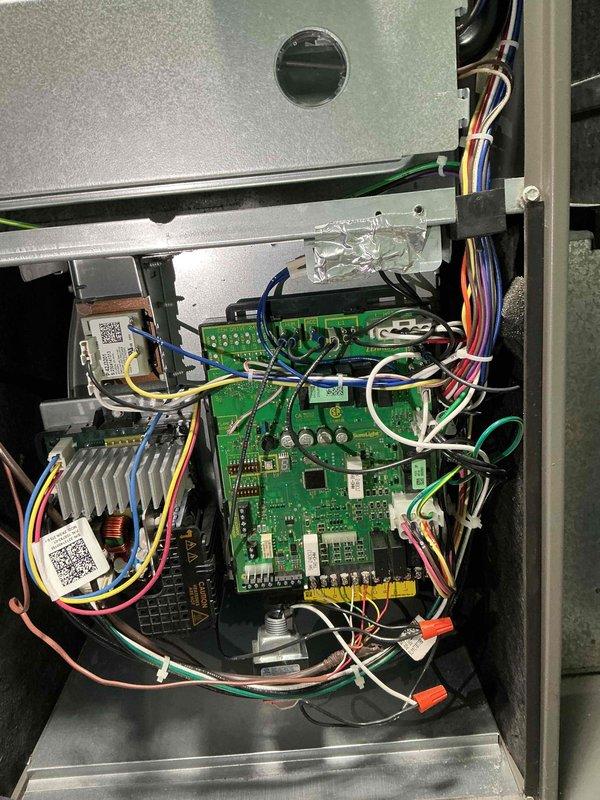 Completed spring clean and check maintenance on single HVAC system per comfort plan agreement. Performed comprehensive inspection of outdoor condensing unit located on side of home, including cleaning of condenser coil, inspection of electrical connections and control board assembly, and verification of proper refrigerant temperatures. Accessed and photographed multi-layer control board system showing proper wiring connections, heat sink assembly, and integrated circuit components in good operating condition. Measured and documented supply air temperature at evaporator coil reading 43.3°F, confirming adequate cooling capacity and proper system operation. All components functioning within normal parameters with no deficiencies noted at time of service.