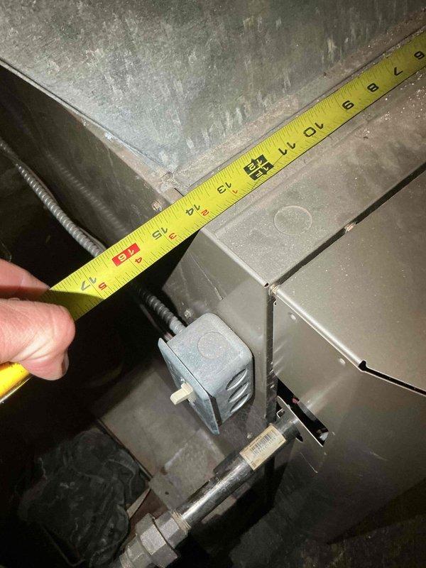 Responded to no cooling complaint on residential split system air conditioning unit, approximately 17 years old. Customer reported outdoor condenser fan motor not rotating. Performed diagnostic evaluation of outdoor unit, inspecting electrical connections, capacitor, and fan motor assembly. Verified indoor furnace and air handler operation in basement location. Documented equipment age and condition with system measurements and photographs of both indoor and outdoor components. Presented repair options and replacement recommendations due to age of system exceeding typical service life expectancy.