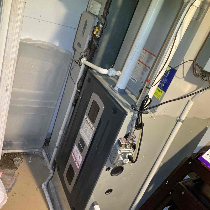 Completed comprehensive clean and check maintenance on two-system HVAC installation per comfort plan agreement. Performed temperature diagnostics on air handler unit, recording supply air temperature of 54.3°F to verify proper cooling performance and system operation. Inspected indoor equipment including furnace/air handler installation, condensate drain lines, electrical connections, and overall system condition with both units operating within normal parameters.