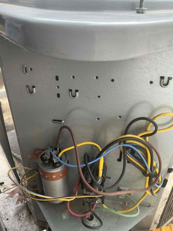 Responded to no cooling complaint on residential air conditioning system. Upon arrival, confirmed unit was running but not providing adequate cooling to living space. Performed diagnostic inspection of outdoor condensing unit and found failed dual run capacitor preventing compressor from operating at full capacity. Replaced defective capacitor with properly rated component and restored system to normal cooling operation. Verified proper amperage draw on compressor and condenser fan motor, confirmed adequate airflow through condenser coil, and tested system performance. Unit cooling properly at time of departure.