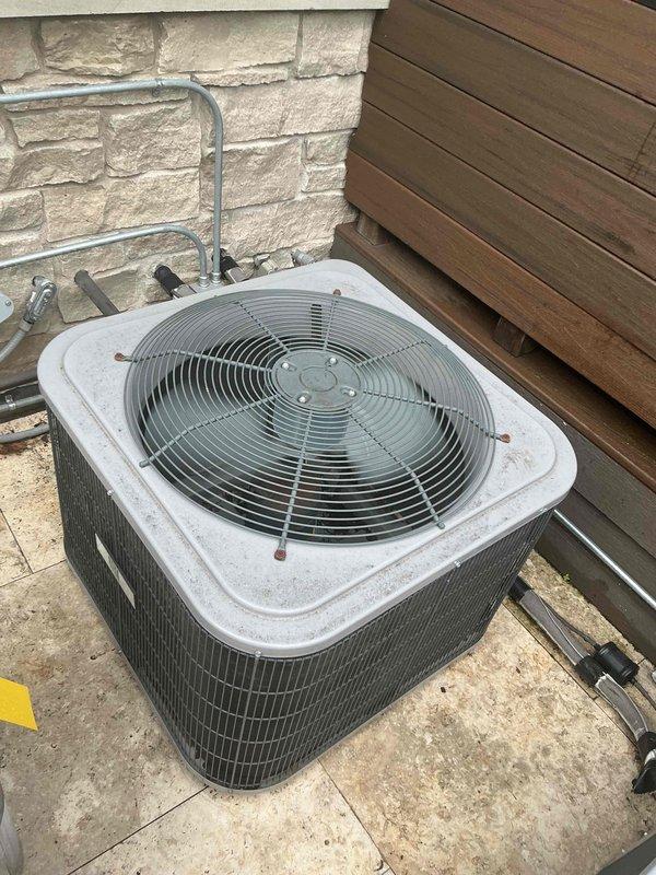 Responded to no cooling complaint on residential air conditioning system. Upon arrival, confirmed unit was running but not providing adequate cooling to living space. Performed diagnostic inspection of outdoor condensing unit and found failed dual run capacitor preventing compressor from operating at full capacity. Replaced defective capacitor with properly rated component and restored system to normal cooling operation. Verified proper amperage draw on compressor and condenser fan motor, confirmed adequate airflow through condenser coil, and tested system performance. Unit cooling properly at time of departure.