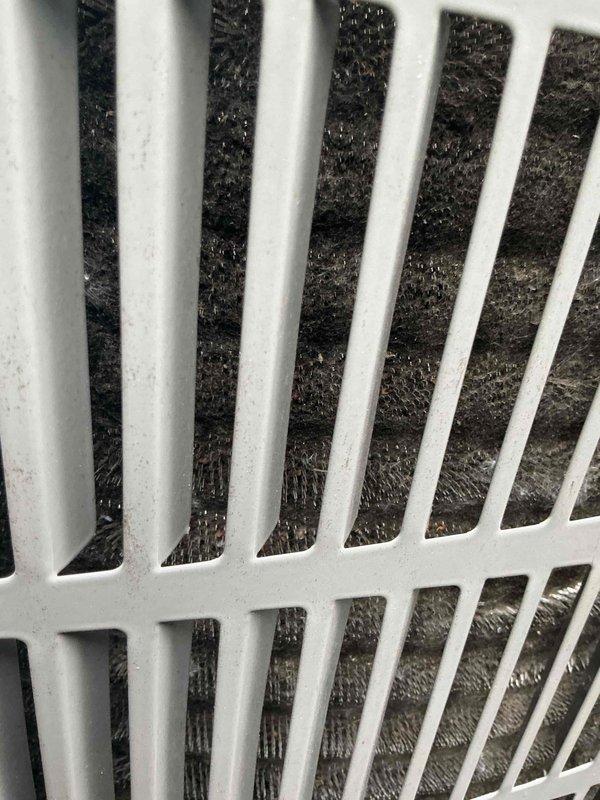 Responded to no cooling complaint on 2022 SpacePak air conditioning system under 10-year parts and labor warranty with no maintenance performed since installation. Upon inspection, discovered substantial dust, lint, and debris accumulation blocking airflow at supply registers. Outdoor condensing unit inspected and found operational with refrigerant lines intact. Documented system conditions with photos showing heavily restricted airflow at vents and outdoor unit placement. Provided diagnostic findings to customer and discussed flat rate repair options, preventive maintenance recommendations, and comfort plan membership benefits to prevent future service issues.