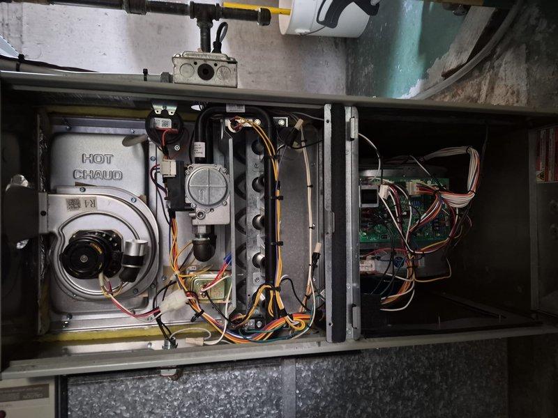 Responded to no cooling complaint on condenser unit model 4A7A3024H1000NA. Upon arrival, confirmed outdoor unit was not operating while indoor blower functioned normally. Inspected condenser and found capacitor failure preventing compressor and condenser fan motor from starting. Tested electrical connections and verified compressor was not locked. Documented system conditions with photos of furnace interior components and outdoor condenser unit showing failed capacitor and wiring connections. Provided diagnostic findings and repair options to restore cooling operation.