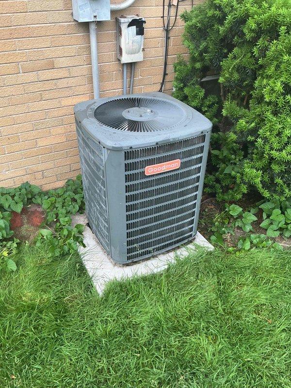 Completed air conditioning clean and check maintenance service per Goodman Comfort Plan agreement on residential split system. Performed comprehensive inspection of outdoor Goodman condenser unit, including cleaning of coils, verification of proper refrigerant levels, electrical component testing, and airflow assessment. System operating within normal parameters with ambient temperature at 70°F and moderate humidity conditions at time of service.