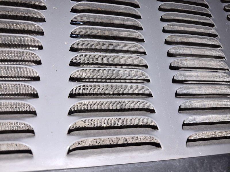 Completed comprehensive tune-up on residential air conditioning system. Inspected electrical components, controls, and refrigerant lines; all operating within normal parameters. Noted significant corrosion and mineral buildup on exterior ventilation louvers that may require future attention to maintain optimal airflow and system efficiency.