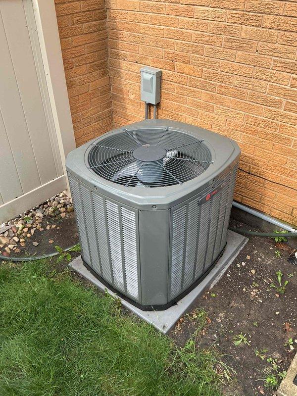 Completed annual air conditioning clean and check maintenance per Comfort Plan agreement. Performed comprehensive system inspection of outdoor condenser unit, verified electrical readings at 253 volts within acceptable range, cleaned condenser coil, and confirmed proper operation of all components.