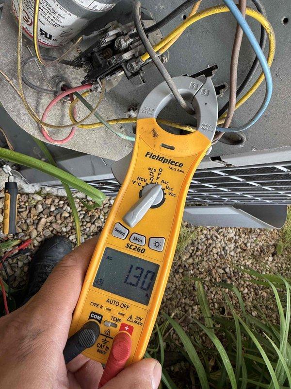 Completed Comfort Plan clean and check on single AC system with reported glitching issues. Performed comprehensive electrical diagnostics using clamp meter, measuring amp draws at contactor and capacitor connections with readings of 19.0A and 17.7A recorded. Inspected all electrical components including capacitor, contactor, and associated wiring connections for proper operation. System evaluated for intermittent performance concerns mentioned in service notes. Collected renewal payment as requested and documented equipment condition with diagnostic photos.