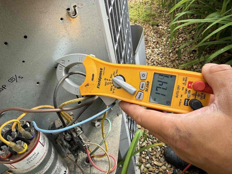 Completed Comfort Plan clean and check on single AC system with reported glitching issues. Performed comprehensive electrical diagnostics using clamp meter, measuring amp draws at contactor and capacitor connections with readings of 19.0A and 17.7A recorded. Inspected all electrical components including capacitor, contactor, and associated wiring connections for proper operation. System evaluated for intermittent performance concerns mentioned in service notes. Collected renewal payment as requested and documented equipment condition with diagnostic photos.