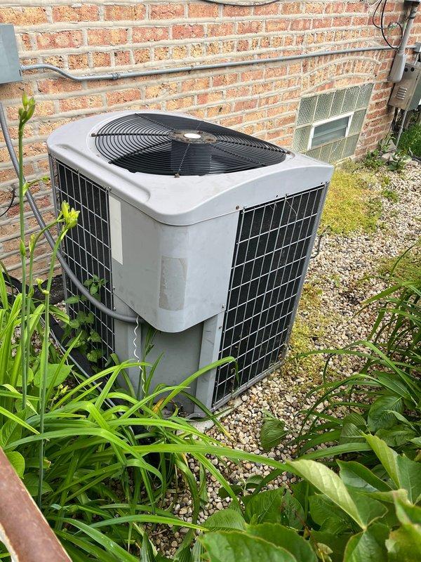 Completed diagnostic evaluation of residential air conditioning system experiencing intermittent operational issues and glitching behavior. Inspected outdoor condenser unit positioned against brick exterior, confirmed unit functionality and assessed overall system condition. Documented existing equipment installation including electrical connections, disconnect box, and proper placement on gravel pad with adequate clearance. Collected membership renewal payment as requested. System evaluated under existing maintenance agreement, no billing generated per customer care protocol.