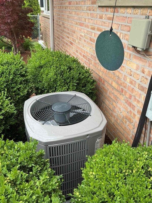 Completed spring clean and check maintenance service on residential air conditioning system and air handler per comfort plan agreement. Performed comprehensive inspection of outdoor condensing unit, verified proper operation of all components, and documented system condition with photos showing unit in good working order with adequate clearance from surrounding landscaping.