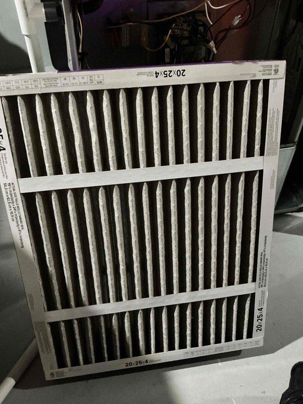 Responded to no cooling complaint on 8-year-old residential HVAC system. Upon arrival, verified thermostat settings, checked circuit breakers, and inspected air filter which showed moderate dust accumulation. Performed diagnostic evaluation of outdoor condensing unit, inspecting capacitor, electrical connections, and refrigerant lines. Documented equipment condition with photographs showing 20x25x4 air filter and condenser electrical components including capacitor and wiring connections. All major components appeared functional with normal wear for age of system.