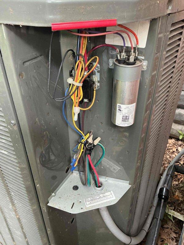 Responded to no cooling complaint on 8-year-old residential HVAC system. Upon arrival, verified thermostat settings, checked circuit breakers, and inspected air filter which showed moderate dust accumulation. Performed diagnostic evaluation of outdoor condensing unit, inspecting capacitor, electrical connections, and refrigerant lines. Documented equipment condition with photographs showing 20x25x4 air filter and condenser electrical components including capacitor and wiring connections. All major components appeared functional with normal wear for age of system.