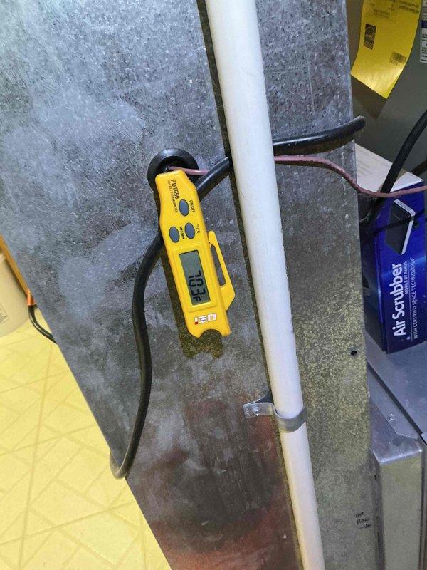 Completed comprehensive clean and check maintenance service on residential air conditioning system and Air Scrubber unit. Performed electrical diagnostics using digital multimeter to verify proper voltage and amperage readings on system components, confirming capacitor functionality and overall electrical performance within manufacturer specifications. All components inspected and found operating normally with no deficiencies noted.