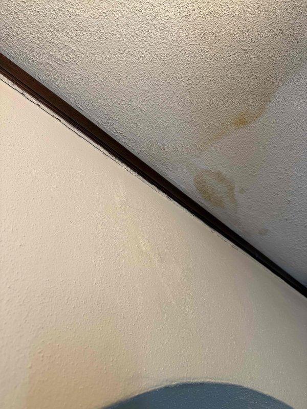 Responded to emergency callback for water pooling under upstairs air handler on 4-year-old system under parts and labor warranty. Upon inspection, discovered condensate drain line was improperly connected, preventing water from being ejected outside as required. Reconnected and secured PVC condensate piping to ensure proper drainage to exterior, verified flow, and confirmed no further pooling at blower unit.