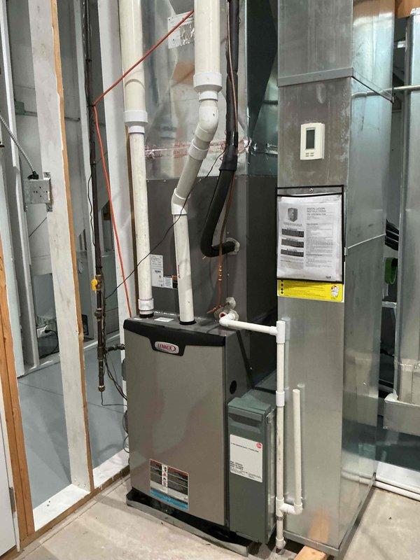 Completed preventative maintenance clean and check service on two Lennox HVAC systems per service contract plan. Performed comprehensive inspection, cleaning, and testing of indoor furnace/air handler unit located in basement and outdoor condenser unit, verifying proper operation of both systems and documenting equipment condition with photos.