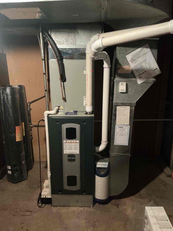 Performed comprehensive Comfort Plan clean and check maintenance on single-system HVAC unit. Conducted thorough inspection of furnace and air conditioning components, verifying proper operation of high-efficiency heating system with PVC venting configuration. Measured supply air temperatures at ductwork using calibrated digital thermometer to confirm system performance parameters. Inspected all accessible mechanical components including furnace cabinet, ductwork connections, and ventilation piping. Verified equipment labels and manufacturer specifications were properly displayed. System found to be operating within normal parameters with no deficiencies noted requiring immediate attention.