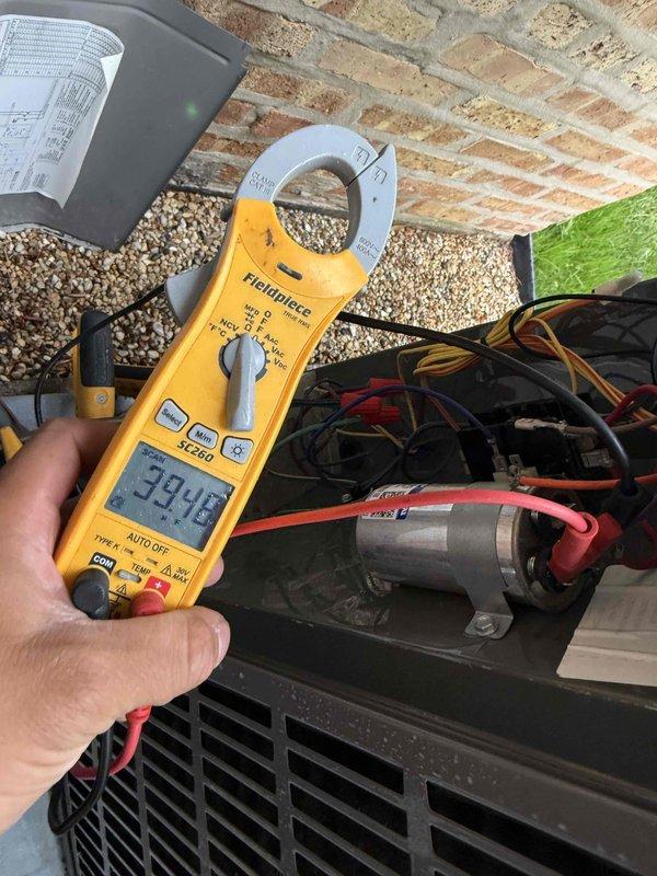 Completed comprehensive tune-up and maintenance on single air conditioning system. Performed electrical diagnostics using clamp meter to verify system amperage draw at 39.98 amps, confirming proper compressor operation. Inspected control board wiring and terminal connections, verifying all wire terminations at W1, W2, BK, X5, B/C, and X2 terminals were secure and properly connected. System tested and operating within normal parameters.