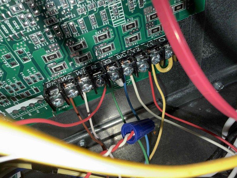 Completed comprehensive tune-up and maintenance on single air conditioning system. Performed electrical diagnostics using clamp meter to verify system amperage draw at 39.98 amps, confirming proper compressor operation. Inspected control board wiring and terminal connections, verifying all wire terminations at W1, W2, BK, X5, B/C, and X2 terminals were secure and properly connected. System tested and operating within normal parameters.
