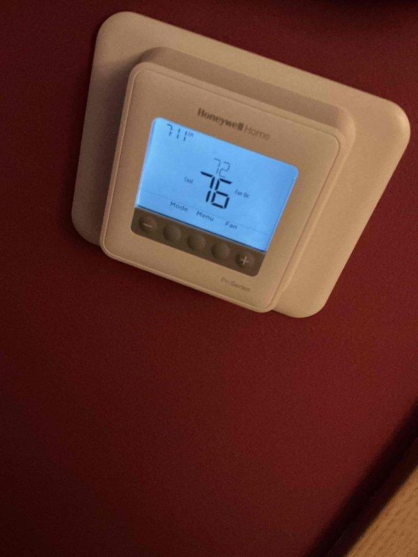 Responded to no cooling complaint with system not maintaining setpoint of 72°F and only reaching 75°F. Upon arrival, verified thermostat reading showing 76°F actual temperature with 74°F setpoint on Honeywell Home digital thermostat. Performed diagnostic temperature measurements at equipment, recording 57°F reading at unit. Conducted standard system evaluation to identify cause of insufficient cooling capacity and temperature differential issue.