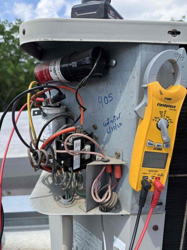 Responded to no-cooling call on residential air conditioning system over 15 years old that had failed the previous fall. Performed diagnostic testing on outdoor condensing unit using digital multimeter to check electrical components including contactor, capacitor, and relay operations. Inspected indoor furnace unit and associated ductwork in mechanical room. Identified failed components preventing system operation and presented repair options for the aging equipment. Discussed benefits of system replacement versus repair given the advanced age of the unit and recommended solutions to restore cooling functionality.