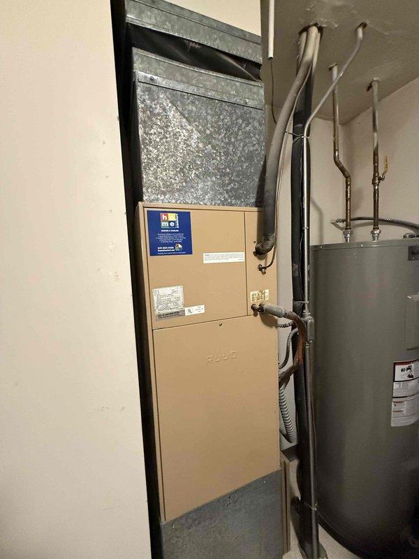Responded to no-cooling call on residential air conditioning system over 15 years old that had failed the previous fall. Performed diagnostic testing on outdoor condensing unit using digital multimeter to check electrical components including contactor, capacitor, and relay operations. Inspected indoor furnace unit and associated ductwork in mechanical room. Identified failed components preventing system operation and presented repair options for the aging equipment. Discussed benefits of system replacement versus repair given the advanced age of the unit and recommended solutions to restore cooling functionality.