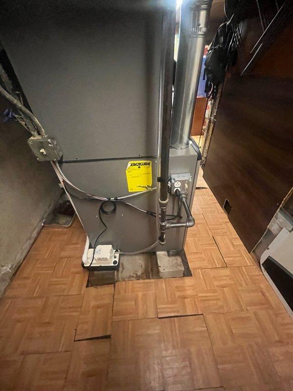 Completed full HVAC system replacement including furnace and air conditioning components. Disconnected and properly disposed of existing forced air furnace and replaced with new Lennox SL280UH070V36AK 66K BTU 80% AFUE two-stage variable speed gas furnace (Cat #26C63). Connected new furnace to existing supply and return air ductwork with necessary sheet metal transitions, attached to existing gas line, electrical circuit, and exhaust system. Reclaimed refrigerant from existing air conditioning condenser, evaporator coil, and copper line-set per EPA regulations. Removed and disposed of old AC condenser and coil. Installed new Lennox 18 SEER2 3-ton air conditioning condensing unit on new pad with pea gravel for proper leveling. Installed new evaporator coil compatible with replacement system. Connected new AC components to existing copper refrigerant lines. Evacuated system to remove moisture and air, then charged with R454B refrigerant to manufacturer specifications. Installed new standa