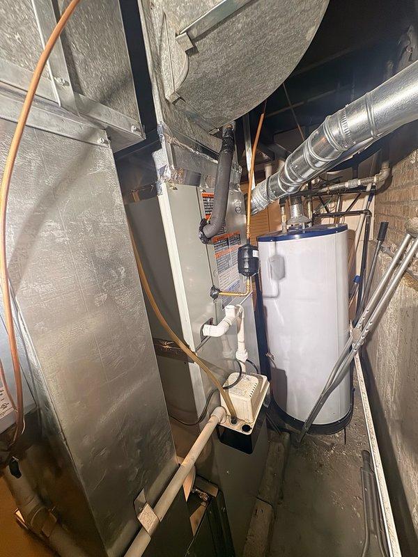 Returned to site to diagnose refrigerant leak location on R-410A system. Inspected air handler unit and determined leak was originating from the evaporator coil rather than the TXV or piston metering device. Replaced defective evaporator coil under manufacturer warranty, evacuated system, and recharged with proper refrigerant specification. Verified system operation and confirmed no additional leaks present.