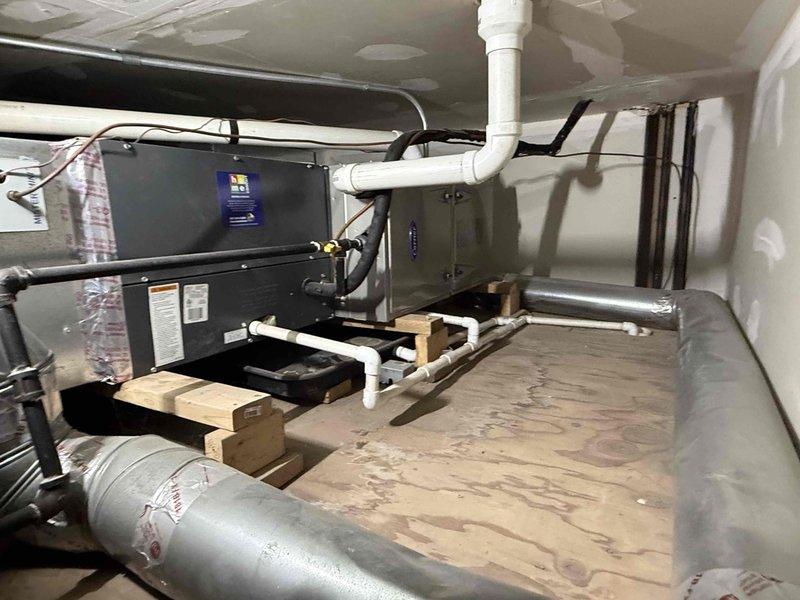 Completed Comfort Plan clean and check maintenance service on two HVAC systems: one air handler unit located in attic crawl space and one rooftop condensing unit installation. Performed comprehensive inspection, cleaning, and testing of both systems per maintenance protocol, collected payment for annual Comfort Plan renewal, and documented equipment conditions with photographs.