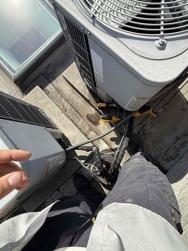 Completed Comfort Plan clean and check maintenance service on two HVAC systems: one air handler unit located in attic crawl space and one rooftop condensing unit installation. Performed comprehensive inspection, cleaning, and testing of both systems per maintenance protocol, collected payment for annual Comfort Plan renewal, and documented equipment conditions with photographs.