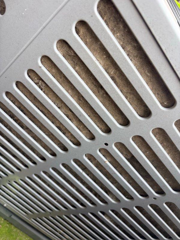 Responded to service call for non-operational second floor air conditioning system. Performed diagnostic evaluation of outdoor condensing unit, utilizing manifold gauges to assess refrigerant pressures and system performance. Inspected indoor air handler and ventilation components, noting dust accumulation on return air grille requiring attention. Completed troubleshooting procedures to identify cause of cooling failure on upper level unit. Additionally performed preventive maintenance service on first floor air conditioning system as requested. Documented all equipment information and captured photographic records of service work performed.