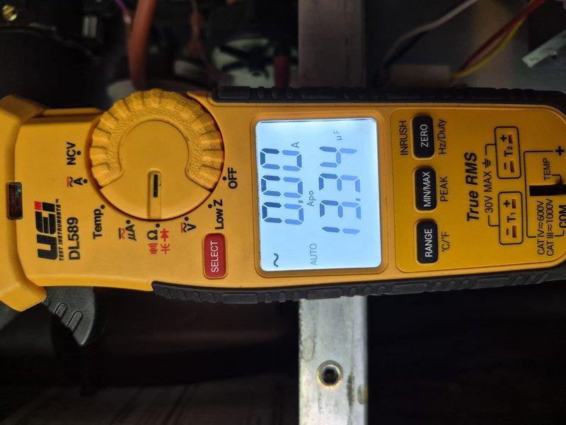 Completed annual air conditioning maintenance on rooftop unit at new commercial building requiring 40-foot ladder access to flat roof approximately 30 feet high. Performed comprehensive tune-up inspection including electrical component testing with clamp meter showing 33-amp draw, verified contactor and capacitor operation, inspected condenser coil condition, documented all equipment specifications and serial numbers, and captured detailed photographs of system components and electrical connections. Discussed comfort program benefits with property representative and collected all necessary equipment information for service records.