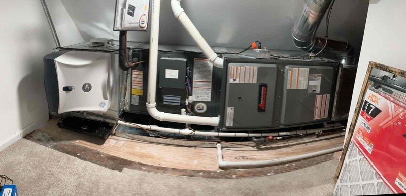 Responded to warranty callback for HVAC system experiencing over-cooling and high indoor humidity levels. Upon arrival, found system operating with thermostat set to 78°F but indoor temperatures reading significantly lower at 60-66°F in various zones, with humidity fluctuating between 53-73%. Investigated thermostat programming and identified dehumidification mode actively engaged, causing system to overcool space in attempt to reduce moisture levels. Adjusted thermostat settings and dehumidification parameters to prevent excessive cooling cycles while maintaining proper humidity control. Verified furnace and air handler operation, inspected condensate drainage system following previous water leak alarm, confirmed drain pan dry and functioning properly. Educated customer on proper thermostat operation and humidity management settings to prevent future over-cooling issues while maintaining comfortable indoor environment.