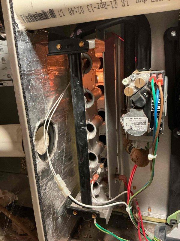 Completed comprehensive heating and cooling system tune-up including full AC clean and check, furnace clean and check, and installation of customer-supplied media filter. Performed combustion analysis and carbon monoxide safety testing on gas furnace burner assembly, confirmed proper operation of all burners and gas valve components. Inspected crawl space installation, verified all system components operating within manufacturer specifications with no humidifier present on system.