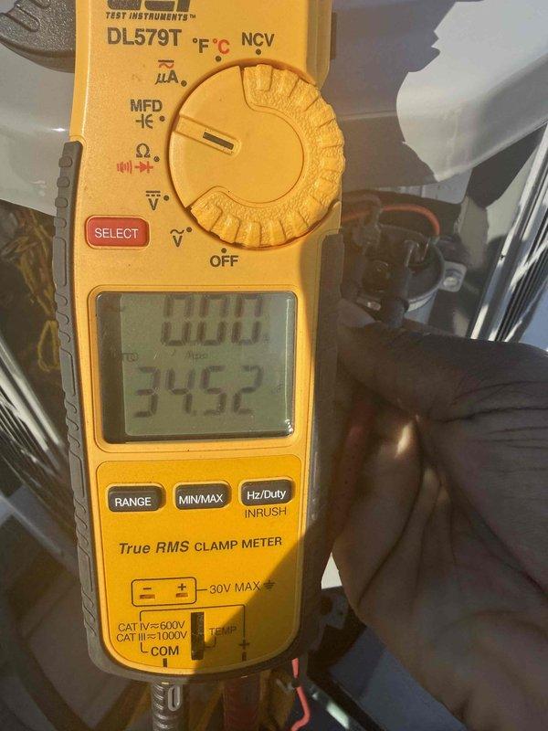 Responded to no cooling call and performed diagnostic evaluation of residential air conditioning system. Upon arrival, utilized digital clamp meter to test electrical components and verify system operation. Measured amperage draws and voltage readings at outdoor condensing unit to assess compressor and fan motor performance. Documented equipment nameplate information and captured diagnostic readings for service records. Discussed findings with customer and presented repair options to restore cooling operation.