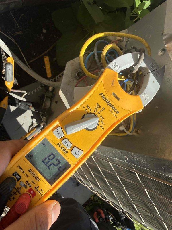 Completed annual air conditioning clean and check maintenance per Comfort Plan agreement. Performed comprehensive system inspection including blower motor assembly, control board operation, and electrical connections. Verified amperage readings at 82.1 amps using clamp meter, confirmed all electrical components functioning within normal parameters, and documented system condition with interior component photography.