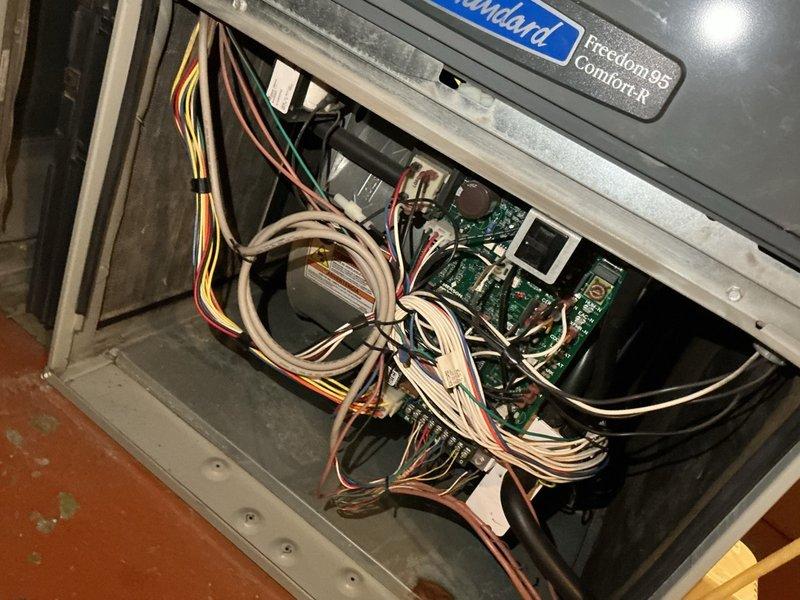 Completed comfort plan clean and check on 16-year-old air conditioning and furnace system. Performed comprehensive inspection of both indoor and outdoor units, including electrical components, control boards, capacitor, and wiring connections. Documented system condition with photos showing FrictionFree Comfort-R branded equipment and internal components. Previously identified heat exchanger issue on furnace requiring replacement estimate; awaiting customer decision on proceeding with repairs given age of equipment and recommendation to schedule work during off-peak cooling season.