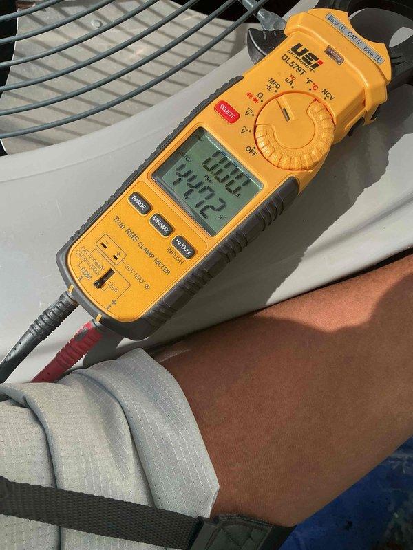 Completed spring maintenance and clean and check service on residential air conditioning system per Comfort Plan agreement. Performed comprehensive system inspection of outdoor condenser unit, verified electrical readings showing 297.2 volts and 60.0 Hz frequency within normal operating parameters, and confirmed unit operational status at 400.0 amp reading. System operating properly with no deficiencies noted at time of service.